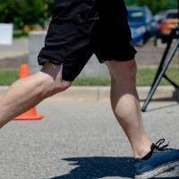 A closeup of a participant's running shoes.
